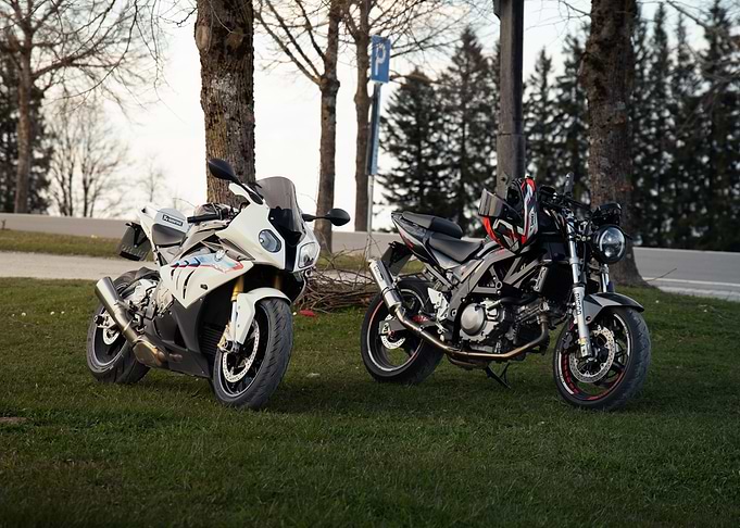 Two Parked Motorcycles on Green Grass