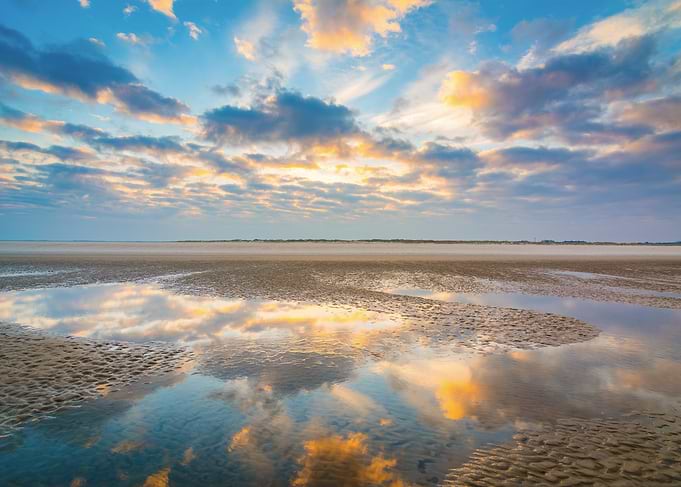 Reflective Beach at Sunrise