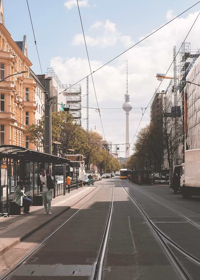 Berlin, Germany I Morning tramway street with Fernsehturm tower in the background moody aesthetic autumn vibes and urban geometry in a raw and authentic industrial sovietic cityscape photography
