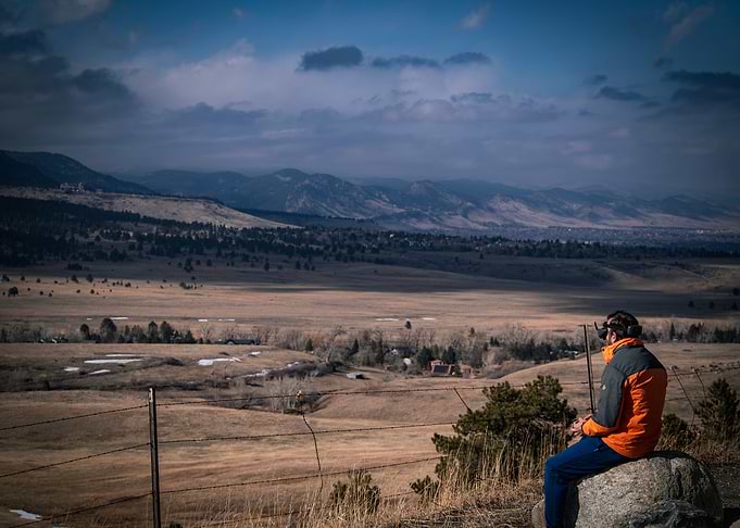 Man with VR headset overlooking the Front Range