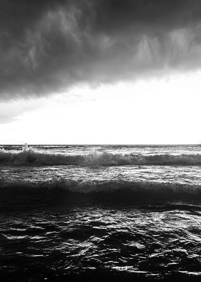 Monochrome Ocean Waves Under Stormy Sky