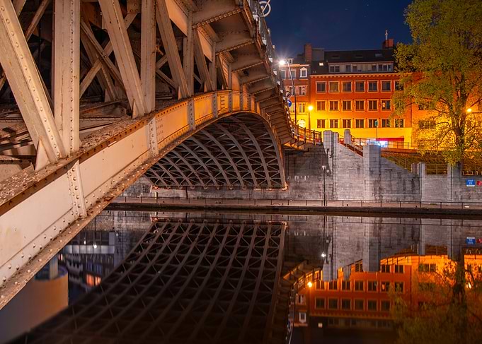 Bridge over water at night