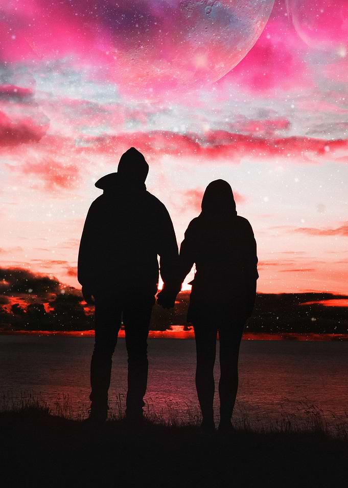 Couple Silhouette Holding Hands at Sunset