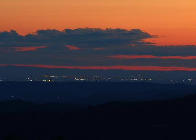 'San Joaquin Sunset' over distant city lights