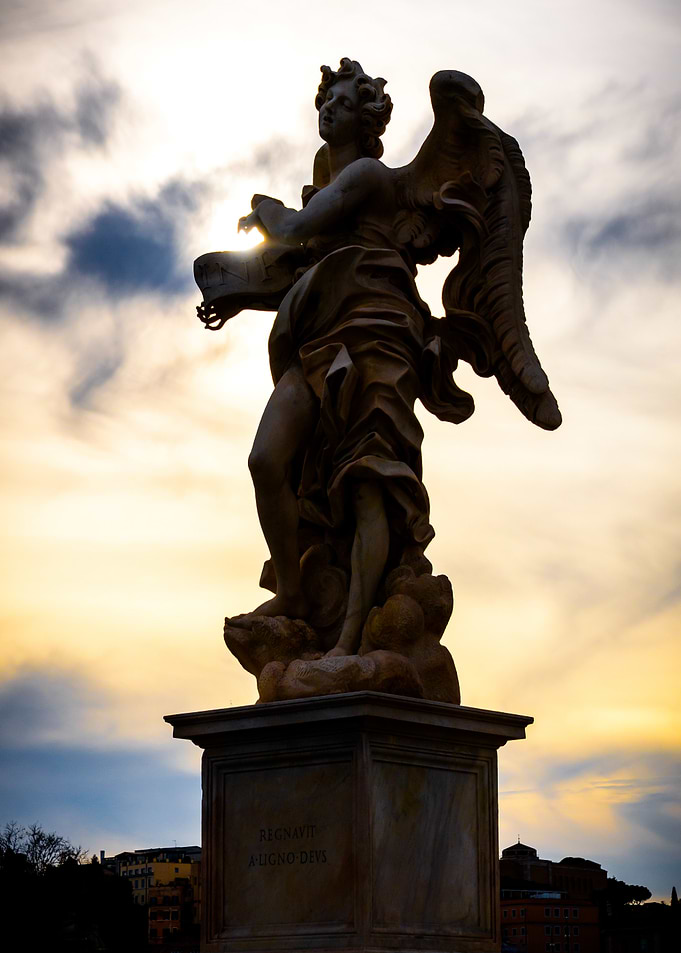Angel Statue Against Sunset Sky