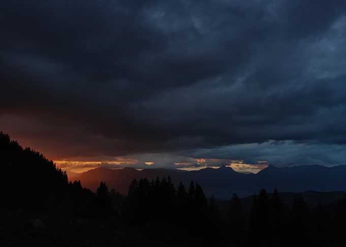 Dramatic Mountain Sunset with Storm Clouds