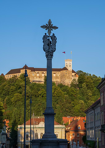 Holy Trinity Column And Ljubljana Castle