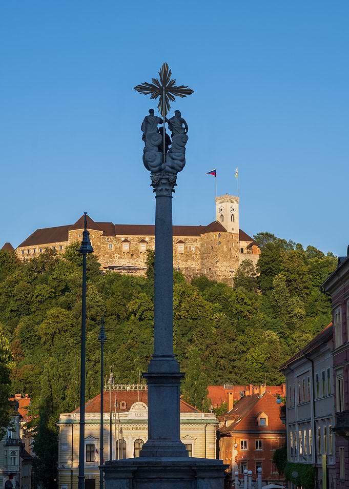 Holy Trinity Column And Ljubljana Castle