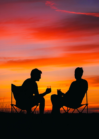 Fiery Horizon – Silhouetted Campers Under a Blazing Sky