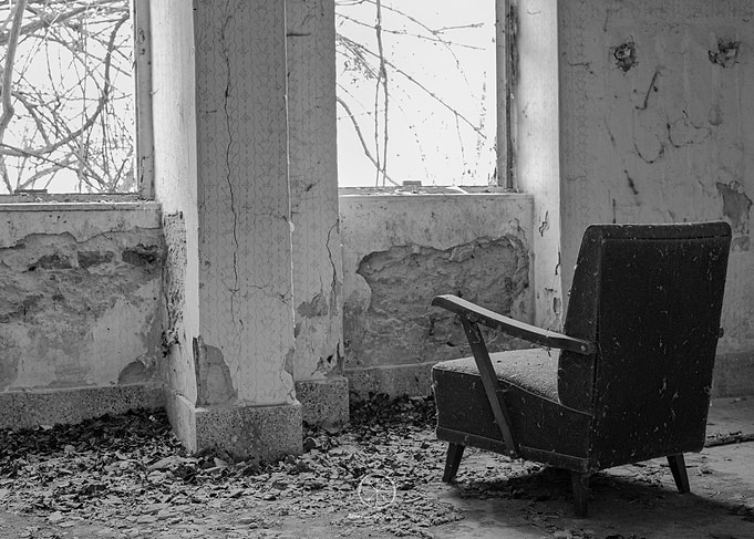 Abandoned Chair in Dilapidated Room