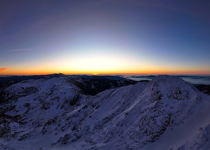 Snowy Mountain Peaks at Sunrise