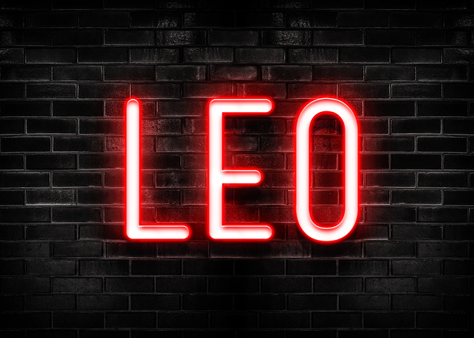 Red Neon 'LEO' on Brick Wall