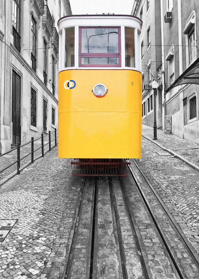 Lisbon, Portugal. Yellow Tram Elevador da Gloria Funicular at Bairro Alto. Selective Color on a Black and White Photo