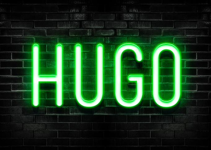 HUGO Neon Sign on Brick Wall