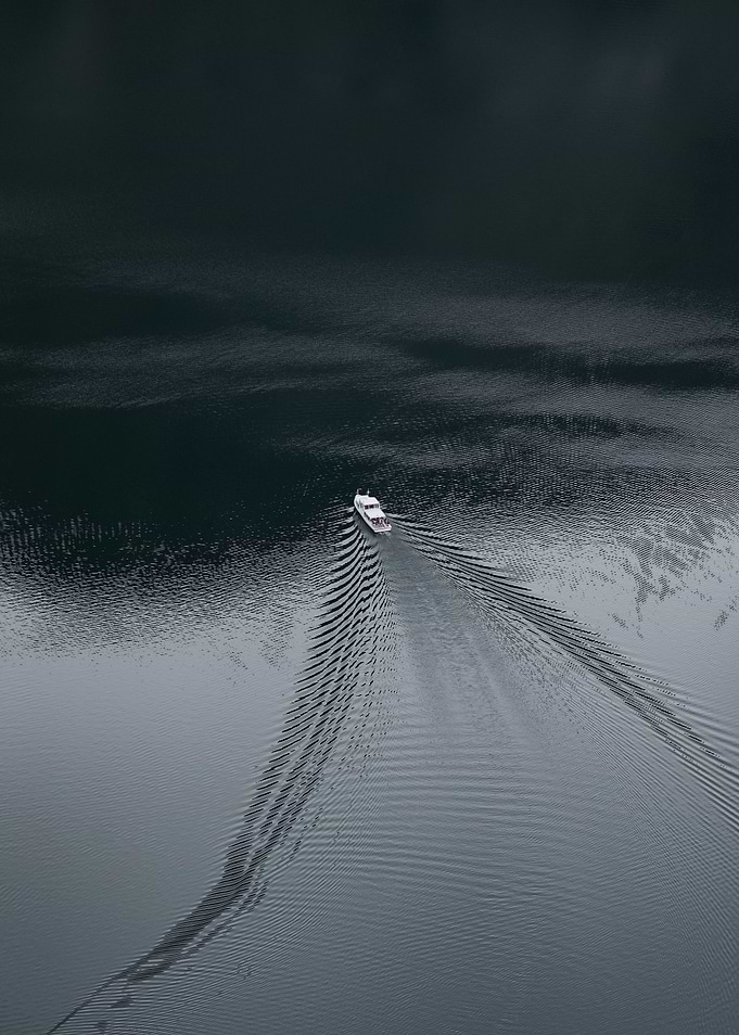 Boat on water with aerial view | Hallstatt, Austria