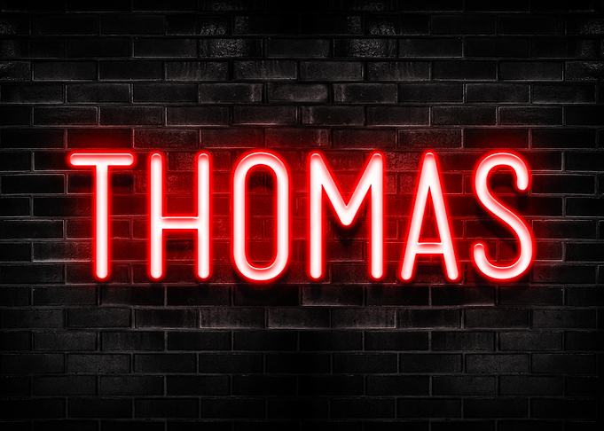 Thomas Neon Sign on Brick Wall
