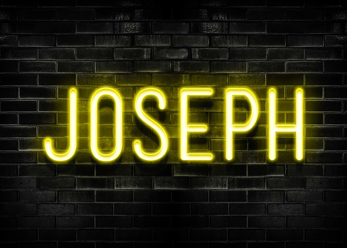 Joseph Neon Sign on Brick Wall