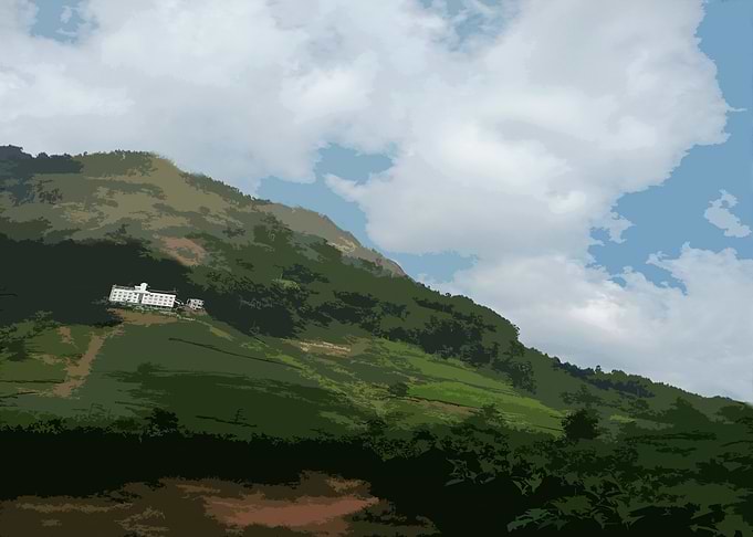 Mountain landscape with building and clouds