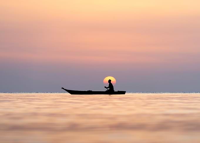Silhouette of boat at sunset in Zanzibar