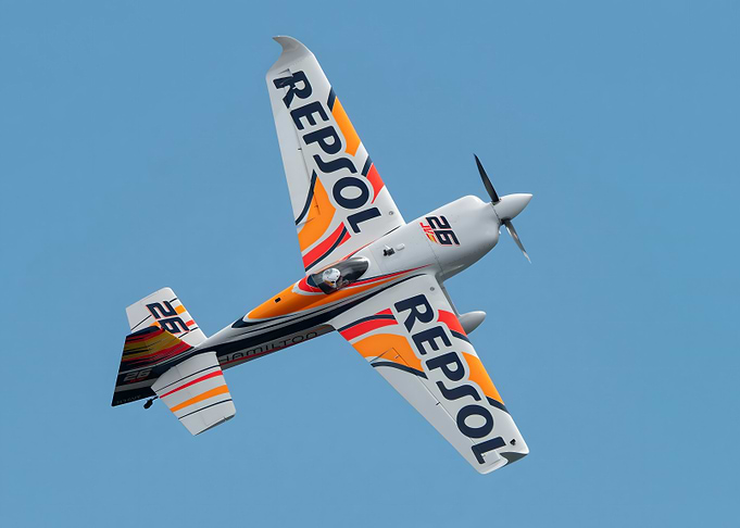 Repsol stunt plane in blue sky