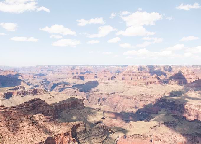 Grand Canyon, USA I Skyline panoramic view of South Rim under a cloudy sky with soft shadows pastel aesthetic for a raw majestic nature landscape photography in the Arizona desert American West canyon