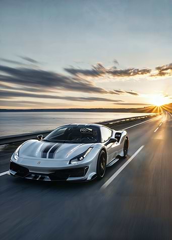 Silver Ferrari on Coastal Road at Sunset