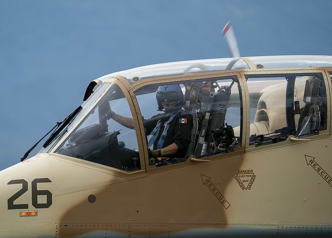 Pilot in cockpit of military plane