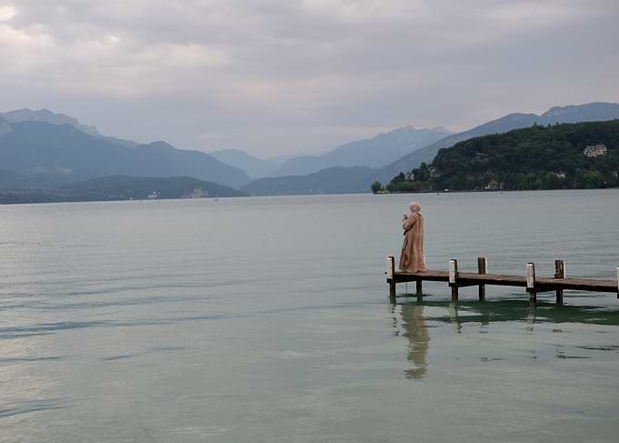 Figure on a dock at lake