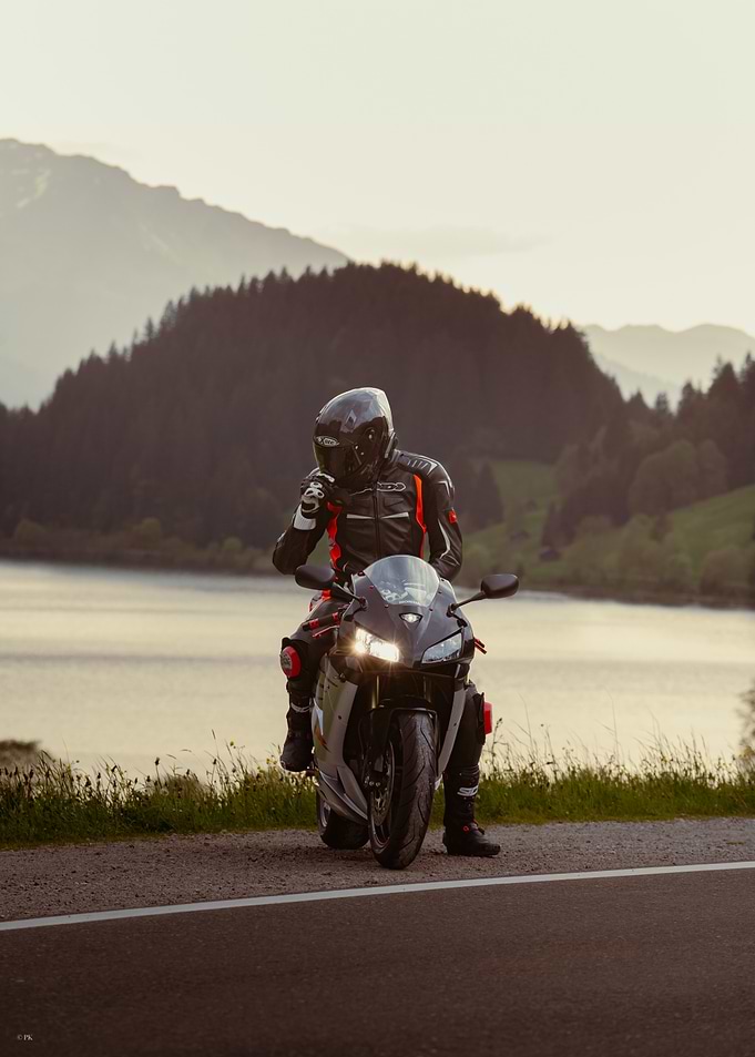 Motorcycle Rider by Lake