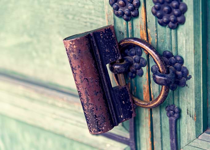 Antique Lock on Green Wooden Door