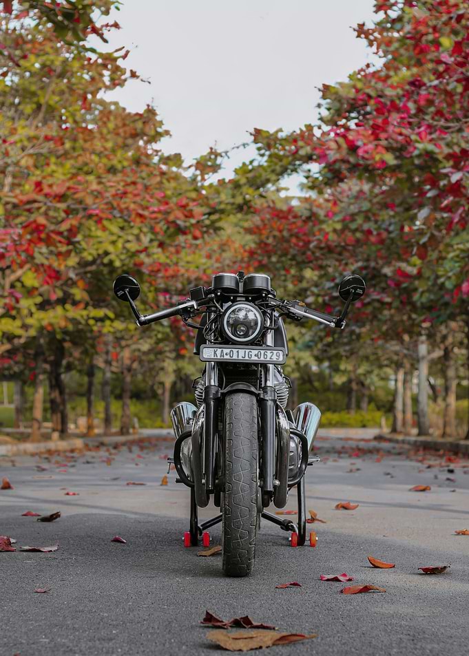 Black Motorcycle on Autumn Road