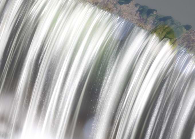Water cascading over a stone edge