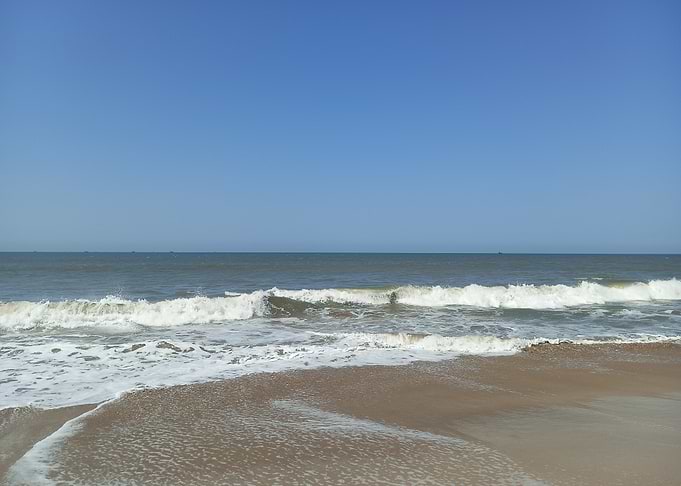 Ocean waves on sandy beach