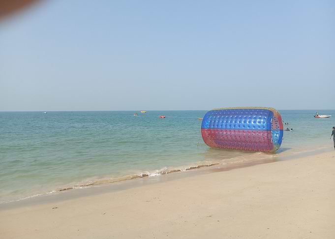 Beach with Inflatable Water Roller