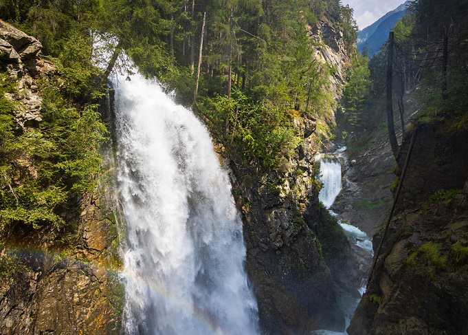 Riva wterfall in a Lush Forest Canyon in Italy