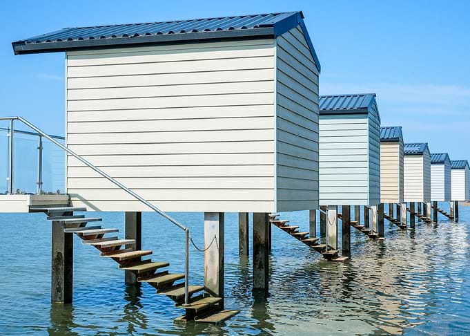 Beach Huts on Stilts in Water