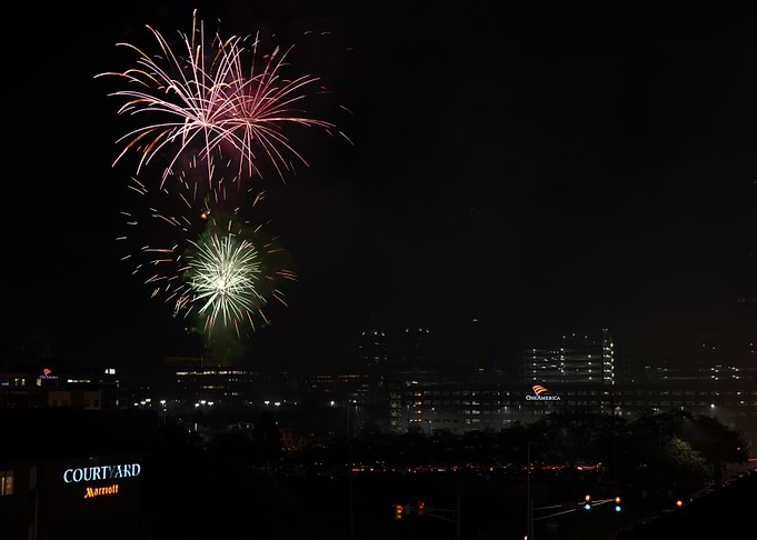 Fireworks over city at night