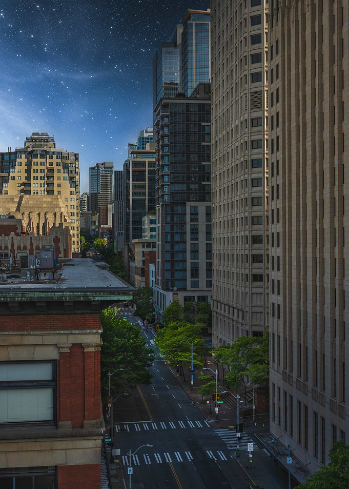Cityscape at Night with Starry Sky