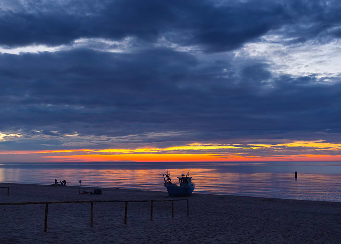 Sunset over the sea with boat, Baltic Sea