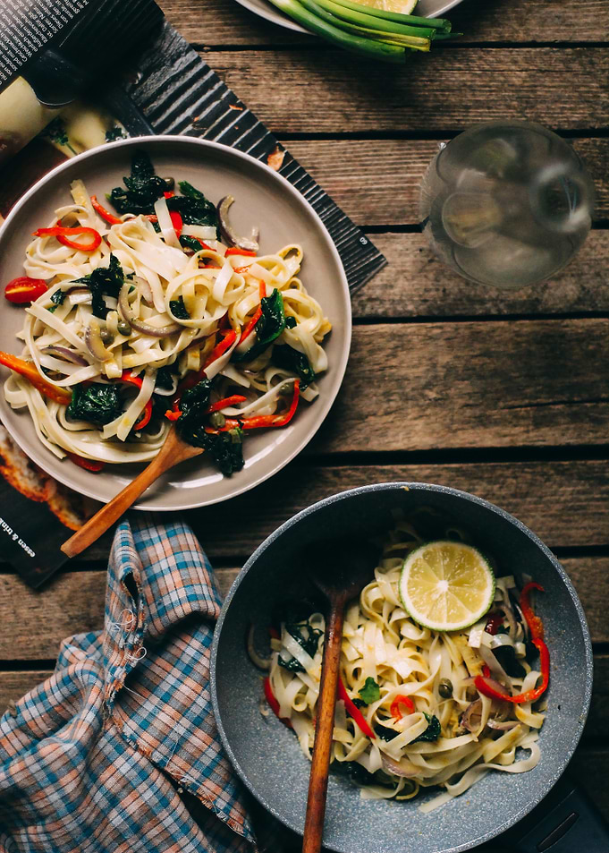 Pasta dishes on wooden table