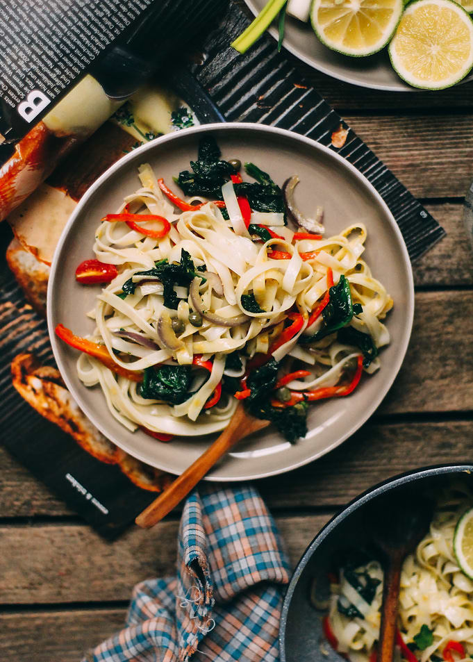 Pasta dish with vegetables on table