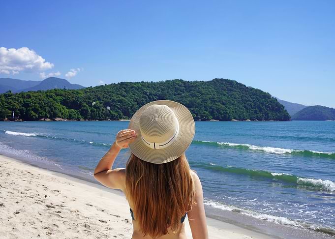 Woman with hat on beach