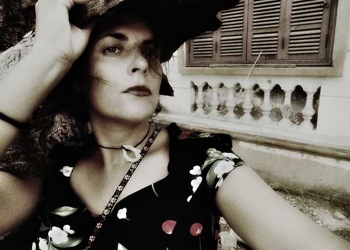 Woman in Floral Dress and Hat