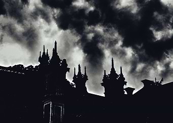 Dark Temple Silhouette Under Stormy Sky