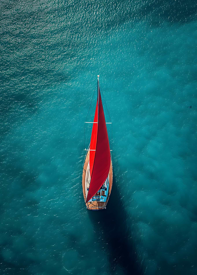 Red Sailboat in Turquoise Water