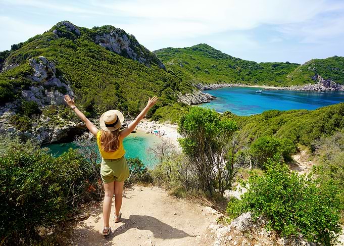 Woman overlooking a tropical beach