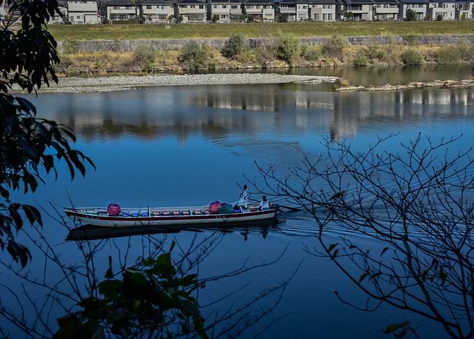 Boat on River in Japanese Landscape