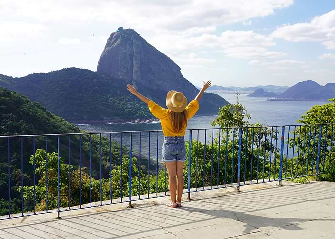 Woman overlooking Sugarloaf Mountain, Rio de Janeiro, Brazil