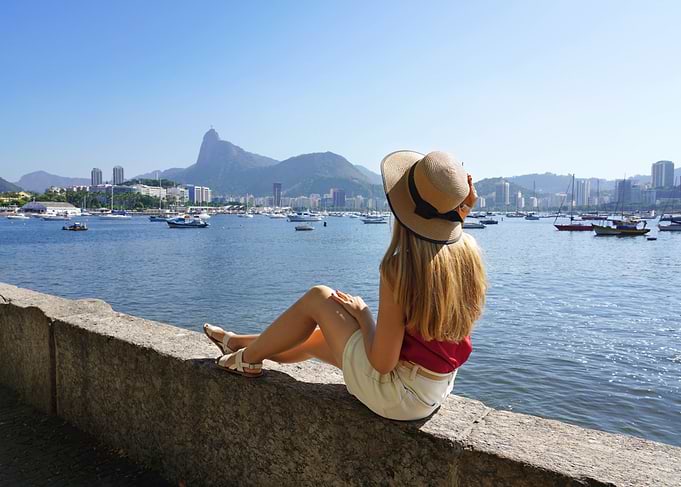 Woman with hat overlooking Rio de Janeiro, Brazil