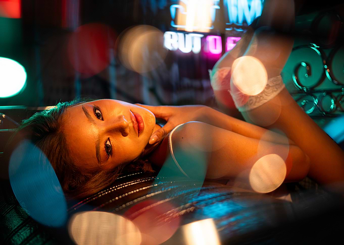 Woman Lying Down with Bokeh Lights